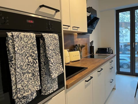 The kitchenette with modern appliances.