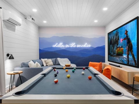 Come chill on the cozy sectional, play a round of pool, and lose yourself in movie-night magic on the giant 120-inch screen with surround sound🍿