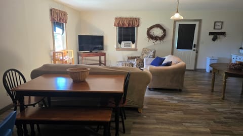 
Dining and living room area showing front door.