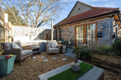 Inviting exterior with stylish barn and seating