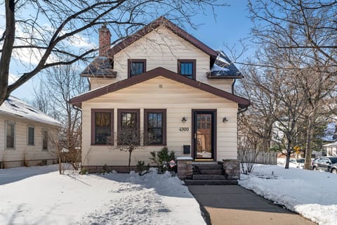 Charming two-story home nestled in a peaceful winter neighborhood, featuring classic architecture and welcoming front entrance at 4300.
