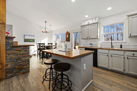 A stylish kitchen island with 2 barstools.