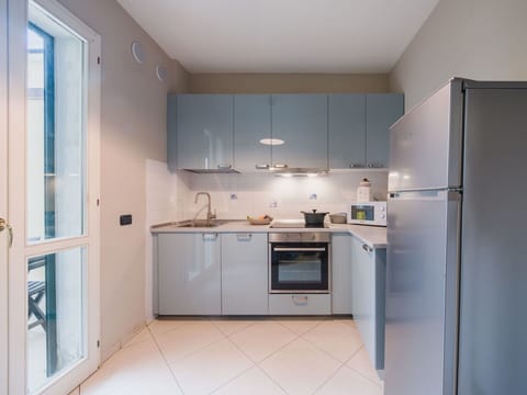 Kitchen Appliance, Kitchen, Countertop, Major Appliance, Cabinetry, Interior Design, Flooring, Furniture, Kitchen Stove, Floor