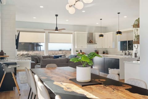Full view of living space, with ocean views, full kitchen, and seating for your whole group.