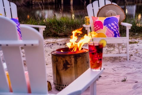 Toes in the sand, fire in the pit, drink in hand. This is the life at the bungalows