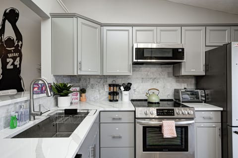 Stainless steel appliances, large double sink, & all the tools you need