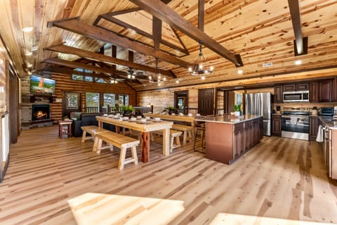 Fully equipped chef’s kitchen with granite countertops and bar seating.
