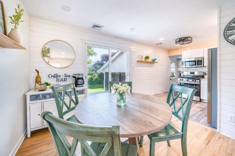 Dining area with sliding doors to the deck and coffee & tea bar.