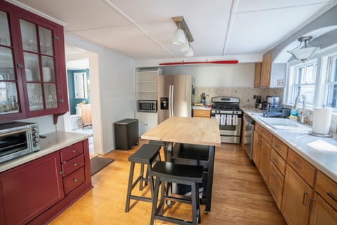Kitchen stocked with cooking/dining essentials and coffee pot
