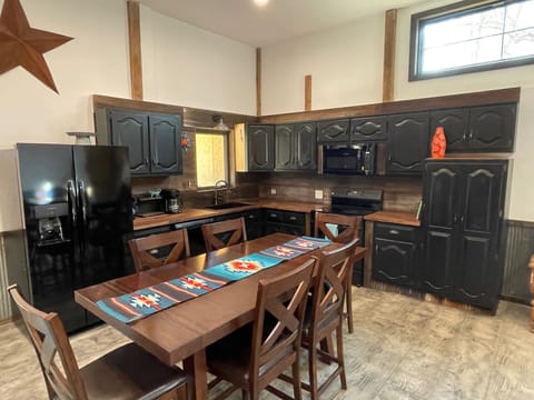 Table has two leaves in the storage room and extra chairs to sit up to 10 people