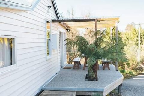 The front deck, outdoor dining area and entryway.