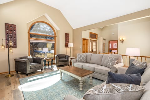 Spacious great room with wood-burning fireplace — one of two living areas at Arbor View