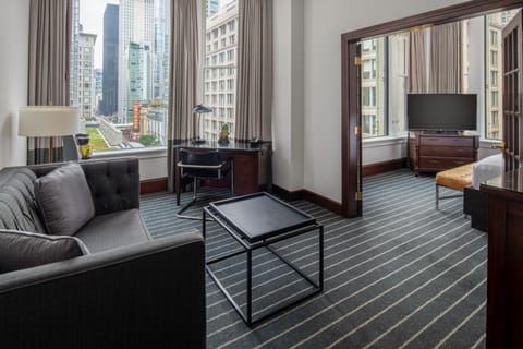 Unwind on the sofa while the skyline frames your stay.
