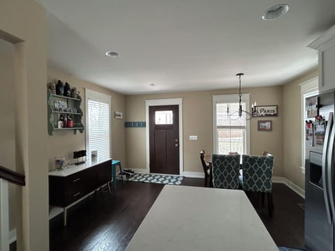 Dining area table and 2 additional seats at the island.