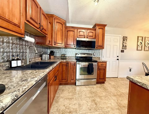 Large eat in kitchen with amenities to cook a snack or gourmet meal