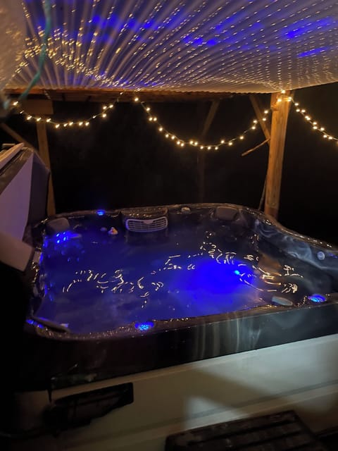 Take a relaxing soak in the hot tub with ambient lighting