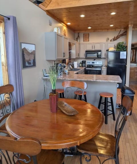 Bright, open-concept dining area and kitchen setup in a Western NC vacation rental close to outdoor adventures