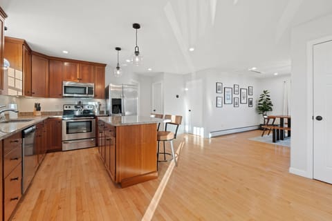 Fully equipped kitchen with all necessary utensils with updated appliances. Open concept kitchen and dining area. Seating for 2 at the island