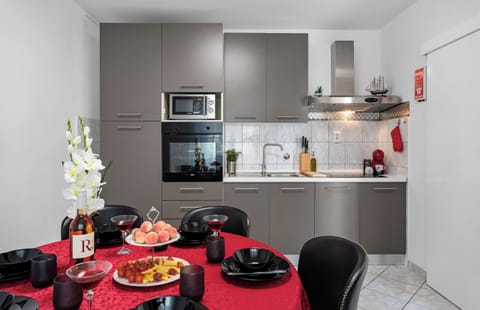 Kitchen is equipped with 2 refrigerators, oven, microwave, coffee maker, kettle