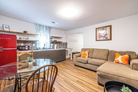 Cozy and efficient—this open living space includes a comfy sitting area, dining for two, and a kitchen all in one easy flow.