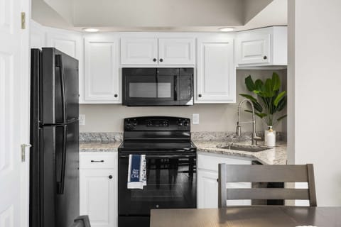 The open, airy kitchen offers ample space & every home comfort