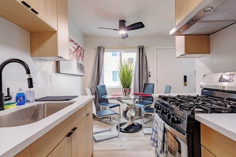 A seamless view from the kitchen into the bright dining area.