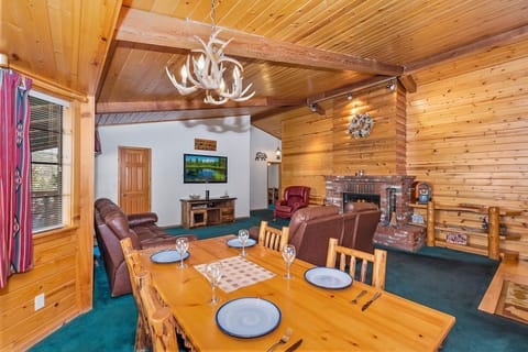 The cabin's open floor plan dining room and living room area!