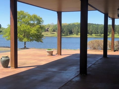 House has two outdoor covered porches overlooking the lake.