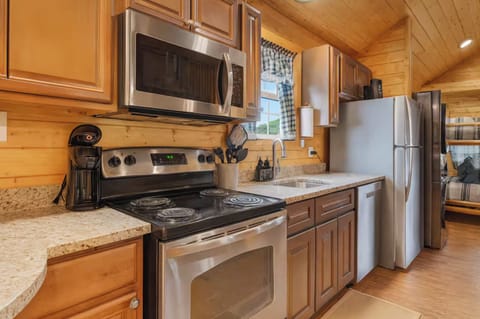 Fully stocked kitchen with new stainless steel appliances.  Stove is electrical 