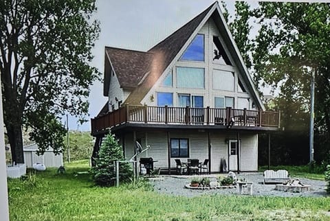 A Frame house. Lower level has bedroom, living room and rec room. 