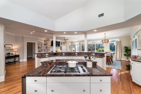 Gourmet kitchen overlooks the dining room and great room