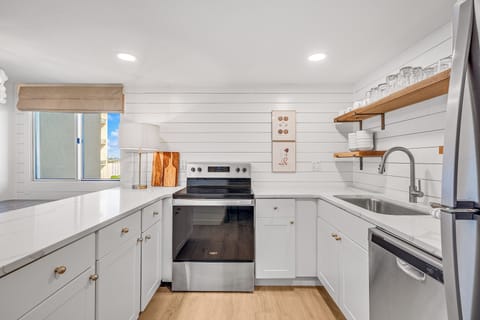 Kitchen - Enjoy cooking in this wonderful, modernized kitchen with open shelving and wonderful counter space.