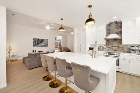 Fully equipped cabin kitchen with ample cabinetry, stove, fridge, microwave, and coffee maker—perfect for cooking meals, morning coffee, and feeling right at home on your stay.