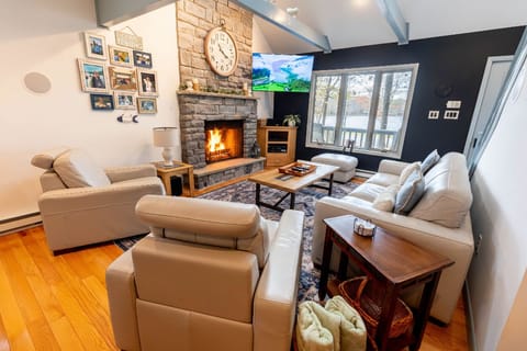 Bright and cozy living room with lake views and direct access to the deck