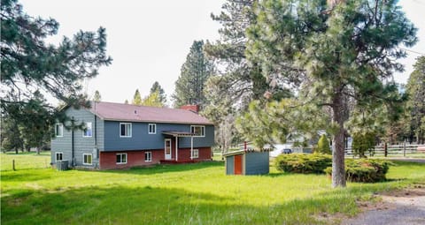 Front of lake house, lawn and well house