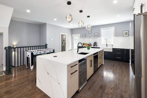 Seamless kitchen-to-living layout designed for entertaining large groups