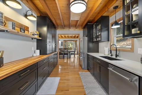 Cook to your heart`s content in our well-stocked kitchen, equipped with a stove, dishwasher, refrigerator, and microwave.