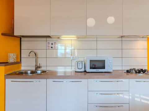 Countertop, Kitchen, Kitchen Appliance, Cabinetry, Major Appliance, Interior Design, Flooring, Wood, Kitchen Sink, Furniture