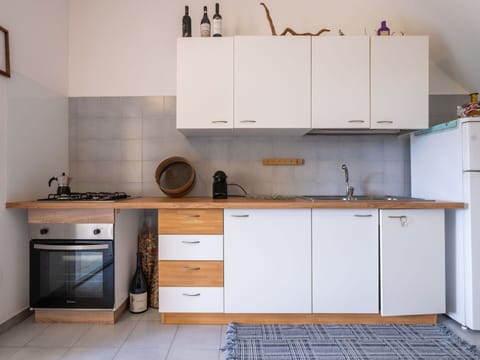 Cabinetry, Countertop, Kitchen, Furniture, Kitchen Appliance, Flooring, Wood, Major Appliance, Interior Design, Kitchen Sink