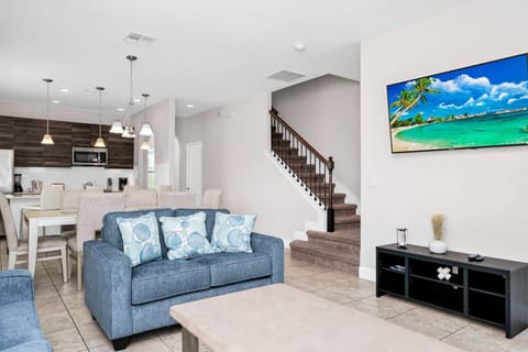 Relax in a cozy and spacious living room, perfect for group gatherings and movie nights!