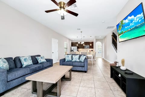 Relax in a cozy and spacious living room, perfect for group gatherings and movie nights!