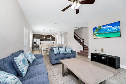 Relax in a cozy and spacious living room, perfect for group gatherings and movie nights!