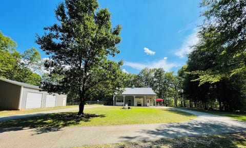 The front of the house with circle driveway. Locked storage building on left.
