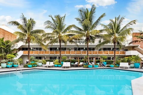 Cool off in the serene pool with shaded corners nearby.