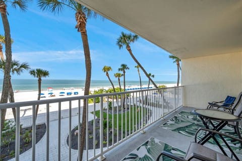 Sip morning coffee on the breezy balcony, framed by swaying palms and bright blue skies.