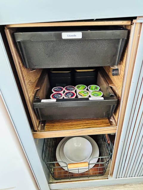 coffee and tea capsules, sugar, creamer, utensils and more