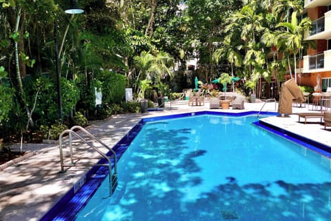 Relax and recharge. Our lush, tropical resort-style pool is the perfect escape from the city bustle