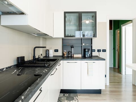 Kitchen, Countertop, Kitchen Appliance, Interior Design, Cabinetry, Major Appliance, Flooring, Kitchen Stove, Wood, Furniture