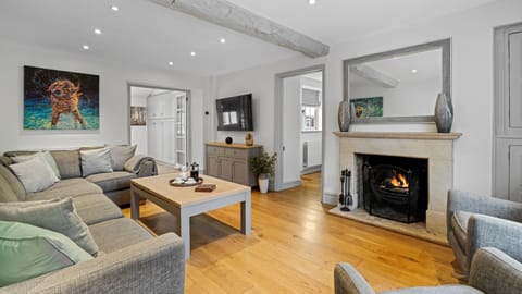 Light the fire and gather in the elegant sitting room