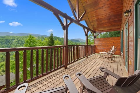 The main level deck has plenty of seating and beautiful Smoky Mountain views.